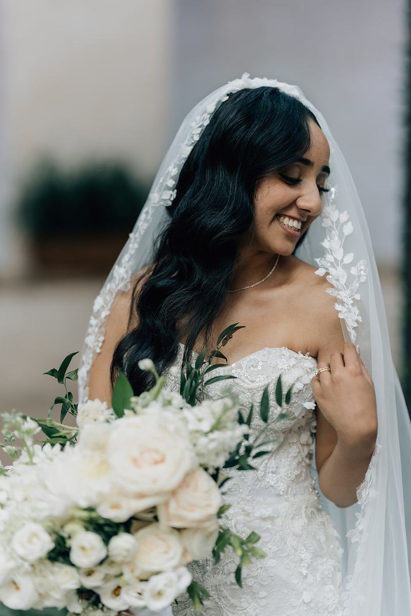 Bride holding an all-white bouquet