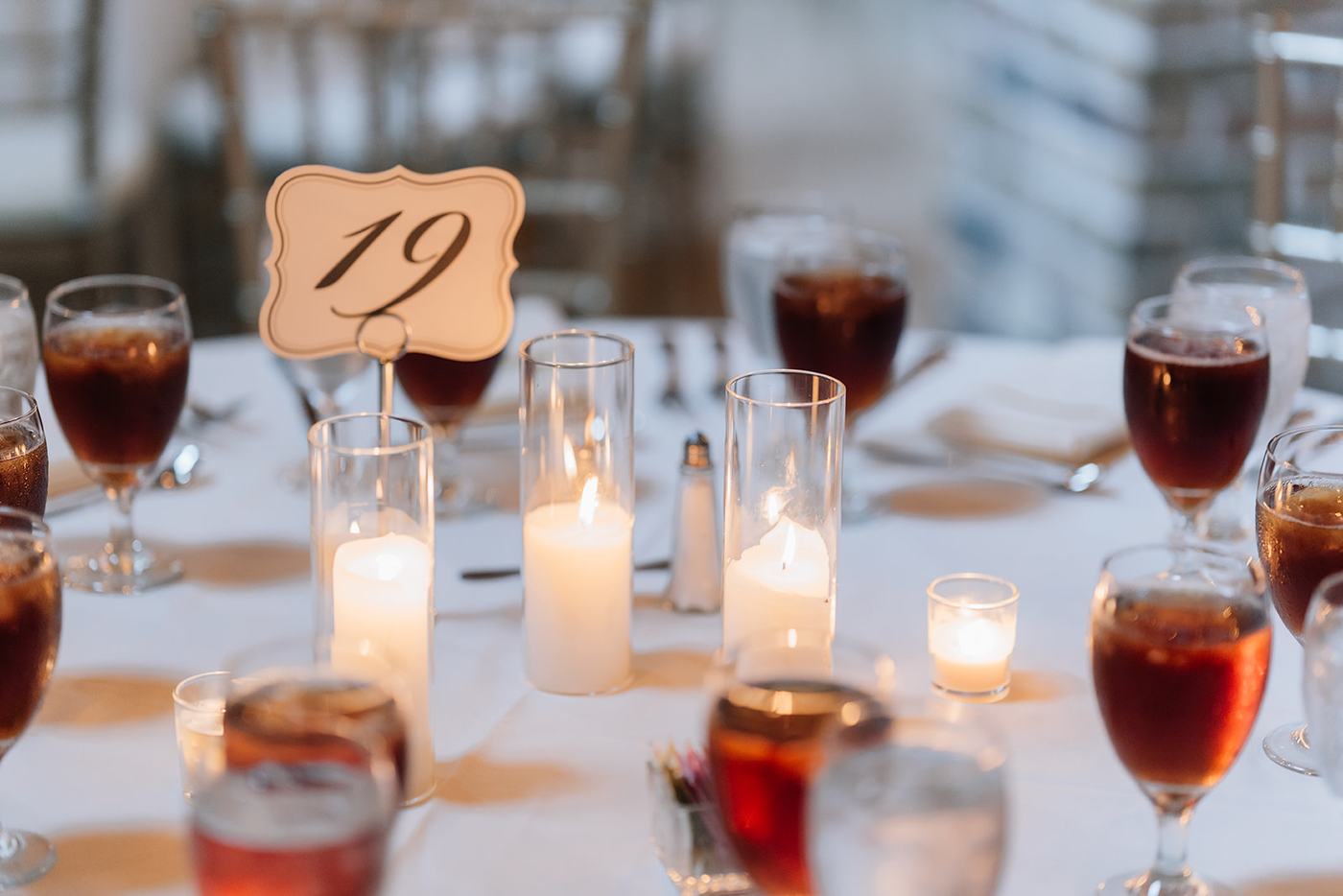 Reception tablescape with taper candles and table number