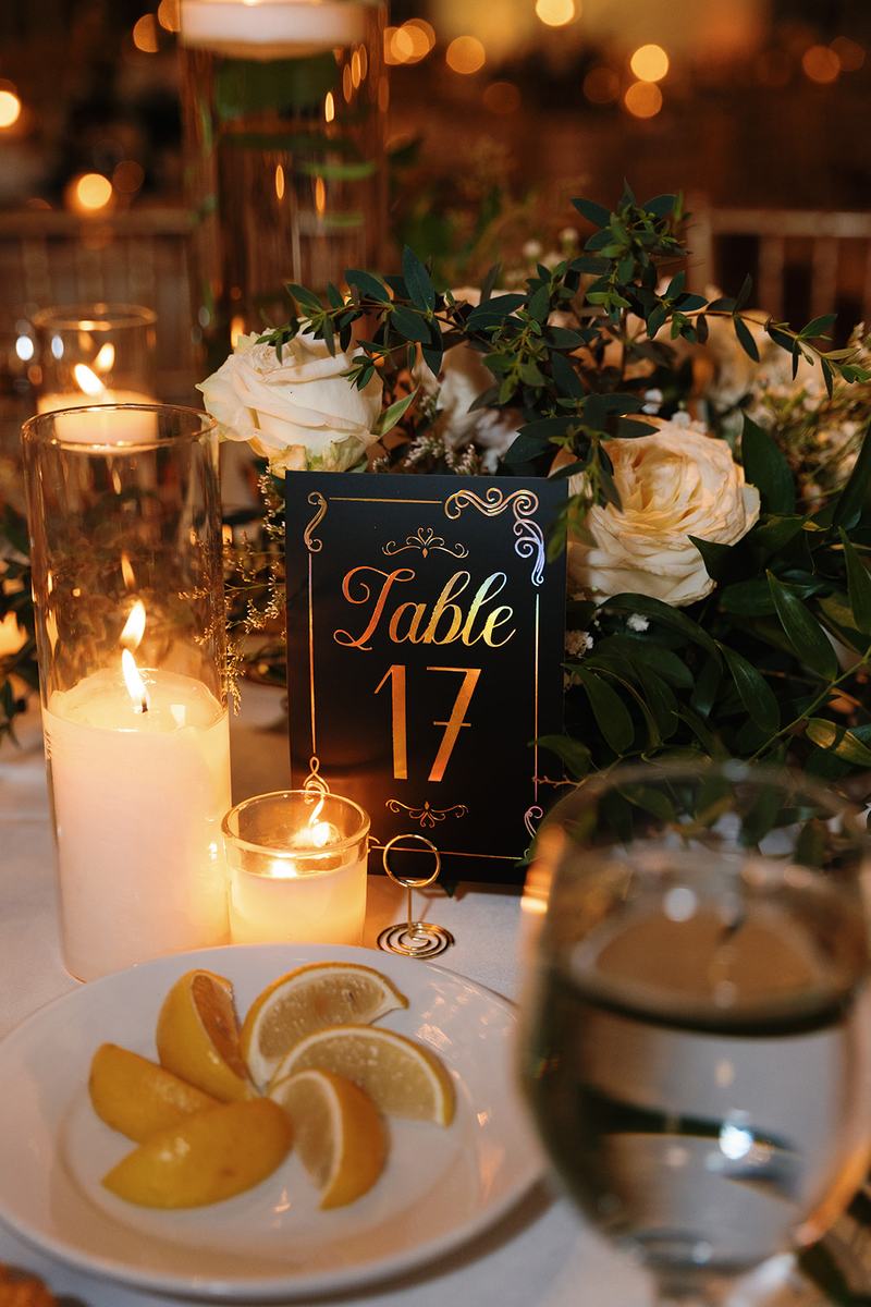 Table number, candles and glassware detail